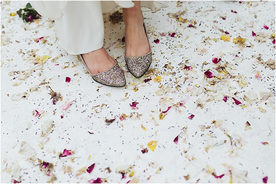Brides shoes and petals