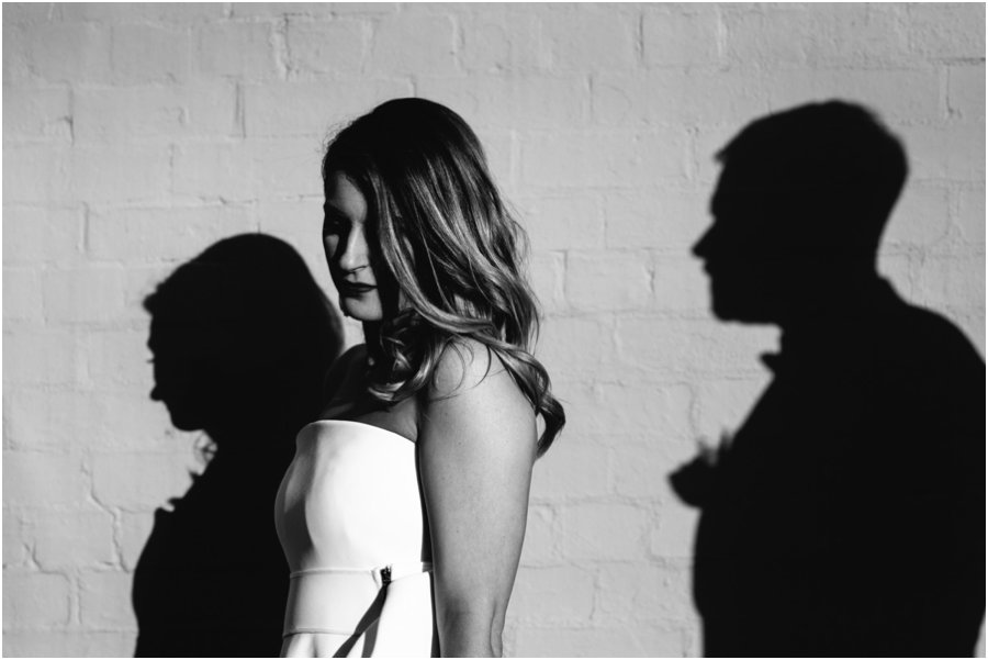 Bride with a shadow of groom in background