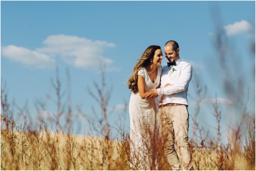 Bride & Groom in wheat at Riverstone