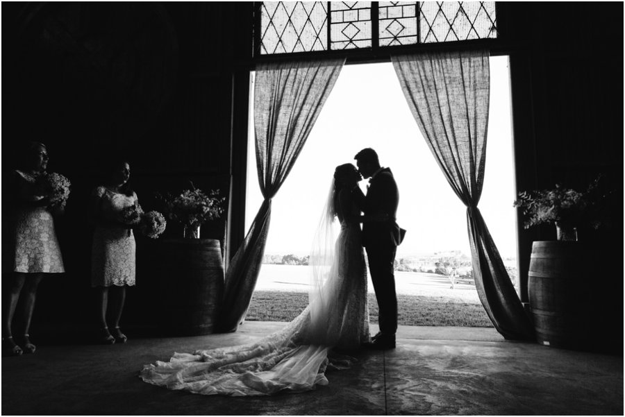 Yarra Valley wedding venues - Silhouette of couples first kiss