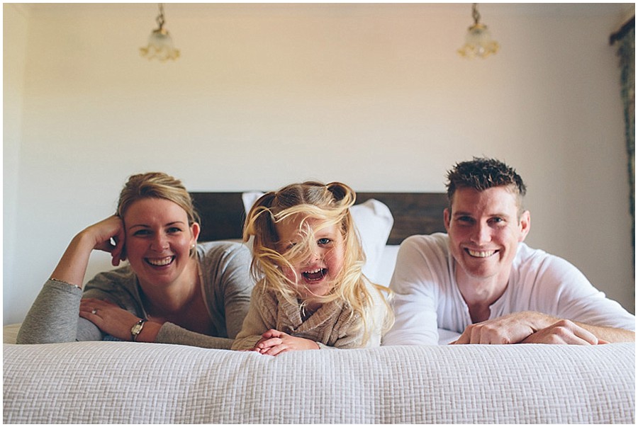 LJM Photography_Recurring Family Portrait_ Family smiling on their bed