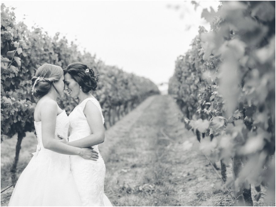 LJM Photography LGBTQI wedding couple embracing in vines