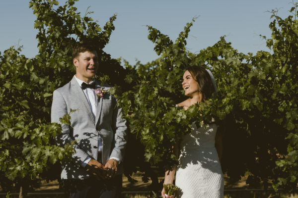 Quirky wedding photography couple in vines