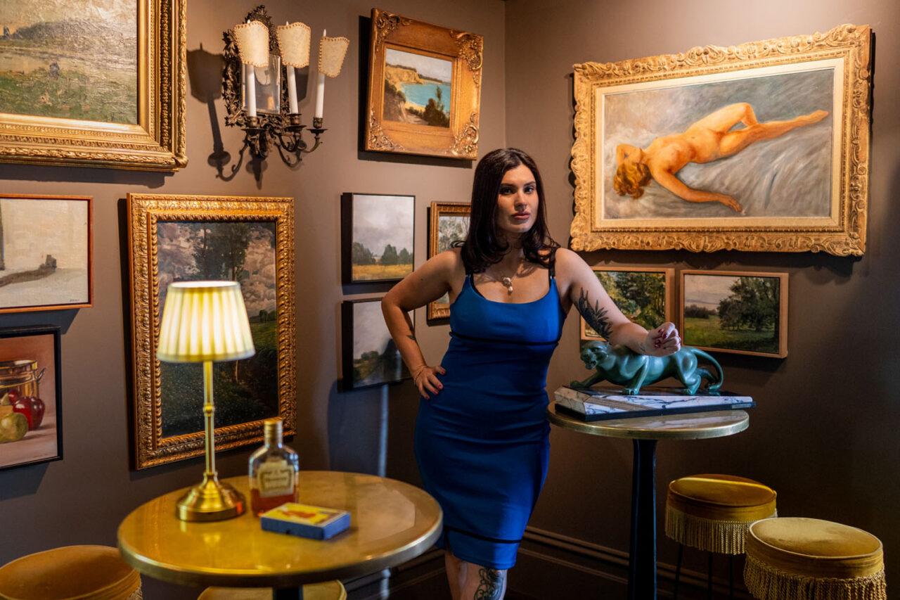 Creative Melbourne headshot with art gallery backdrop and warm tones