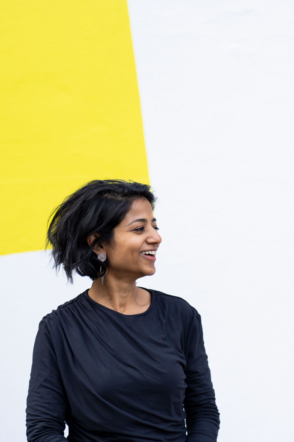 Modern Melbourne headshot against bold yellow and white wall