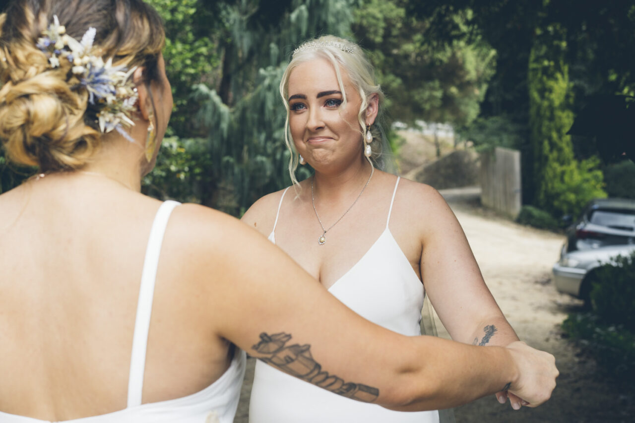 Brides seeing each other for the first time at Alowyn Gardens in Yarra Valley