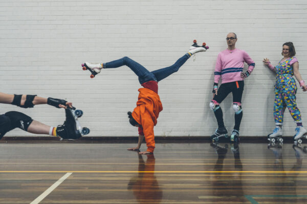 Diverse, queer Roller skaters doing tricks.