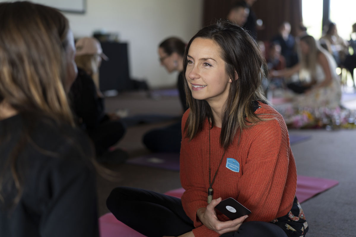 Two woman engaged in an Intimate conversation at an event