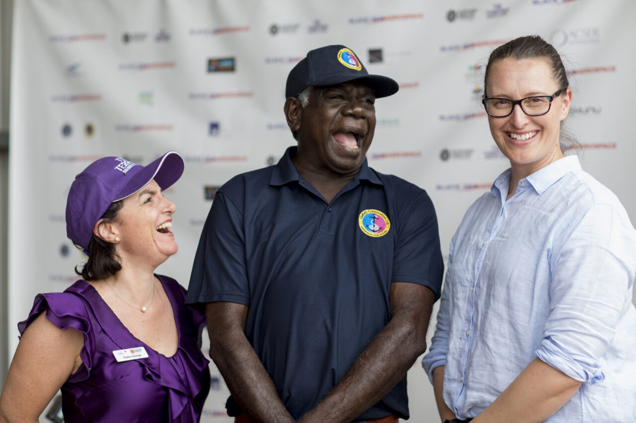 Indigenous event capturing three people laughing