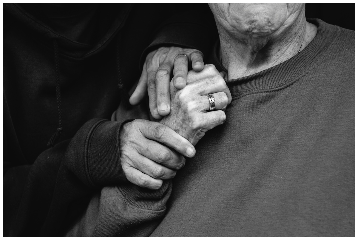 Tight shot of two women embracing their hands