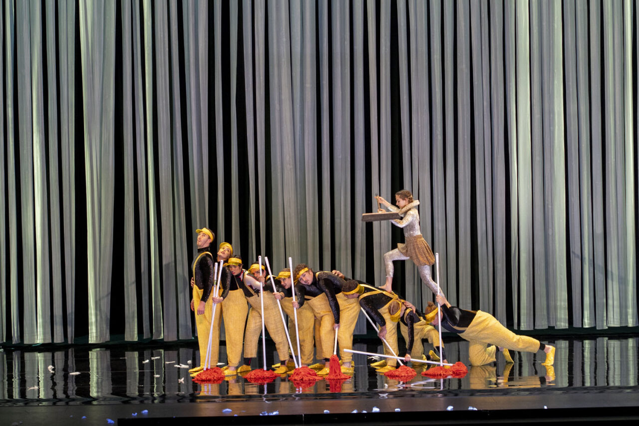 Circa performers dressed in yellow costumes forming a playful duck formation on stage during Duck Pond at The Round Melbourne, photographed by Lauren Marshall.