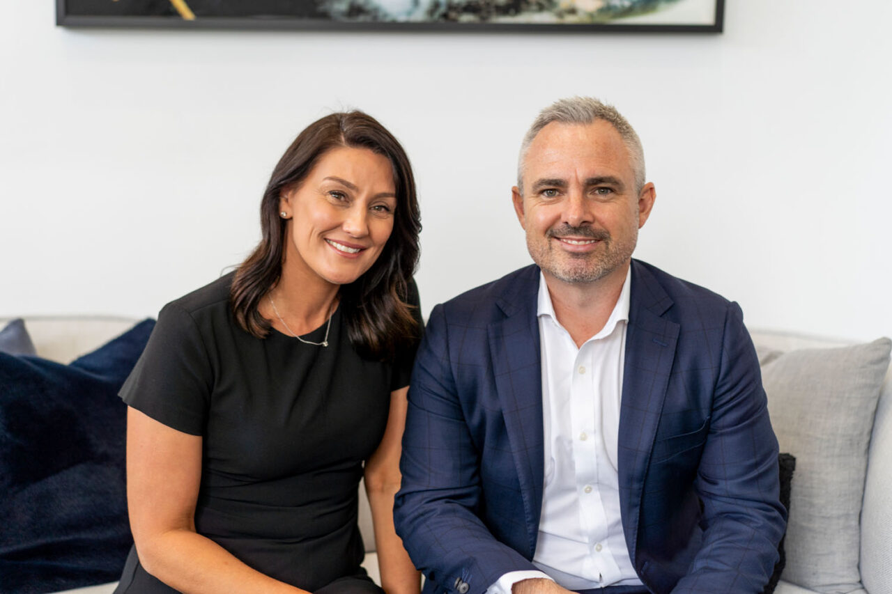 Two Barry Plant Yarraville real estate agents sitting together for a professional headshot