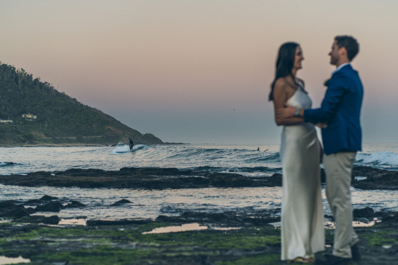Couple holding each other at the ocean during sunset on the Surf Coast