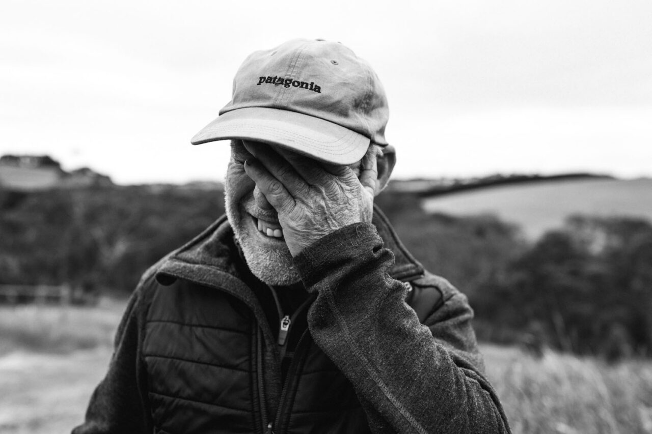 Genuine moment of laughter captured outdoors, showing real human connection through photography