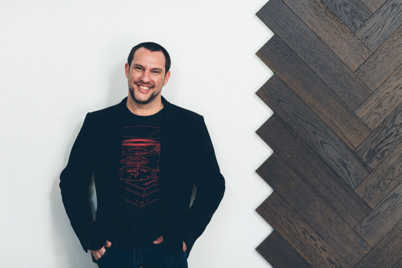 Authentic brand photography portrait of a local business owner in a relaxed, modern setting in Torquay