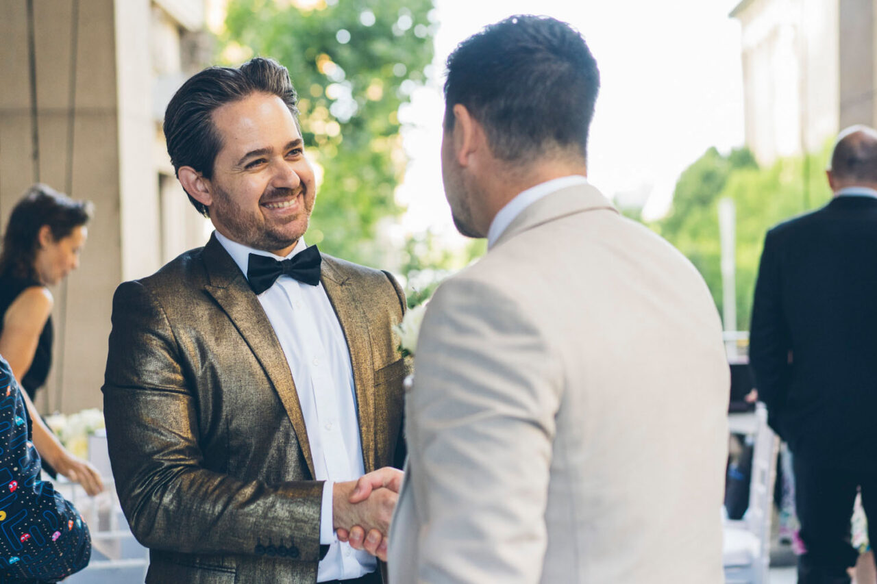 Darren Sibson greeting groom before ceremony at Melbourne wedding