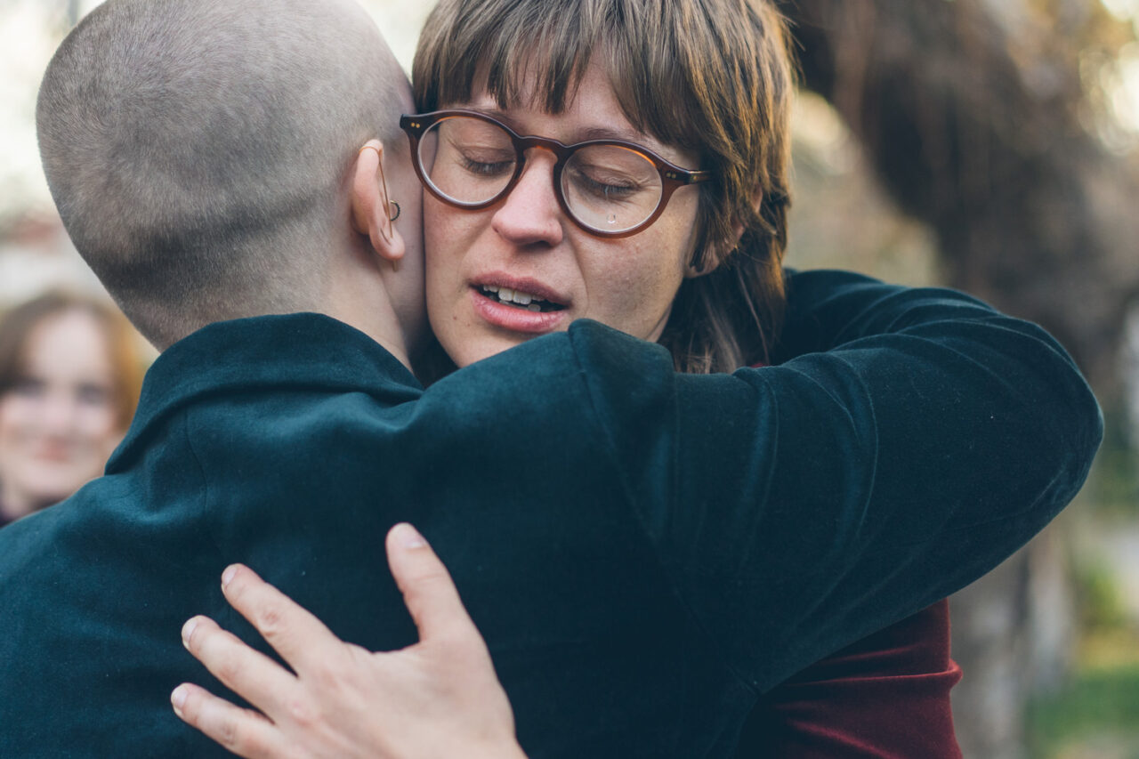 Emotional embrace between Naomi and Bec after exchanging vows at their Daylesford wedding.
