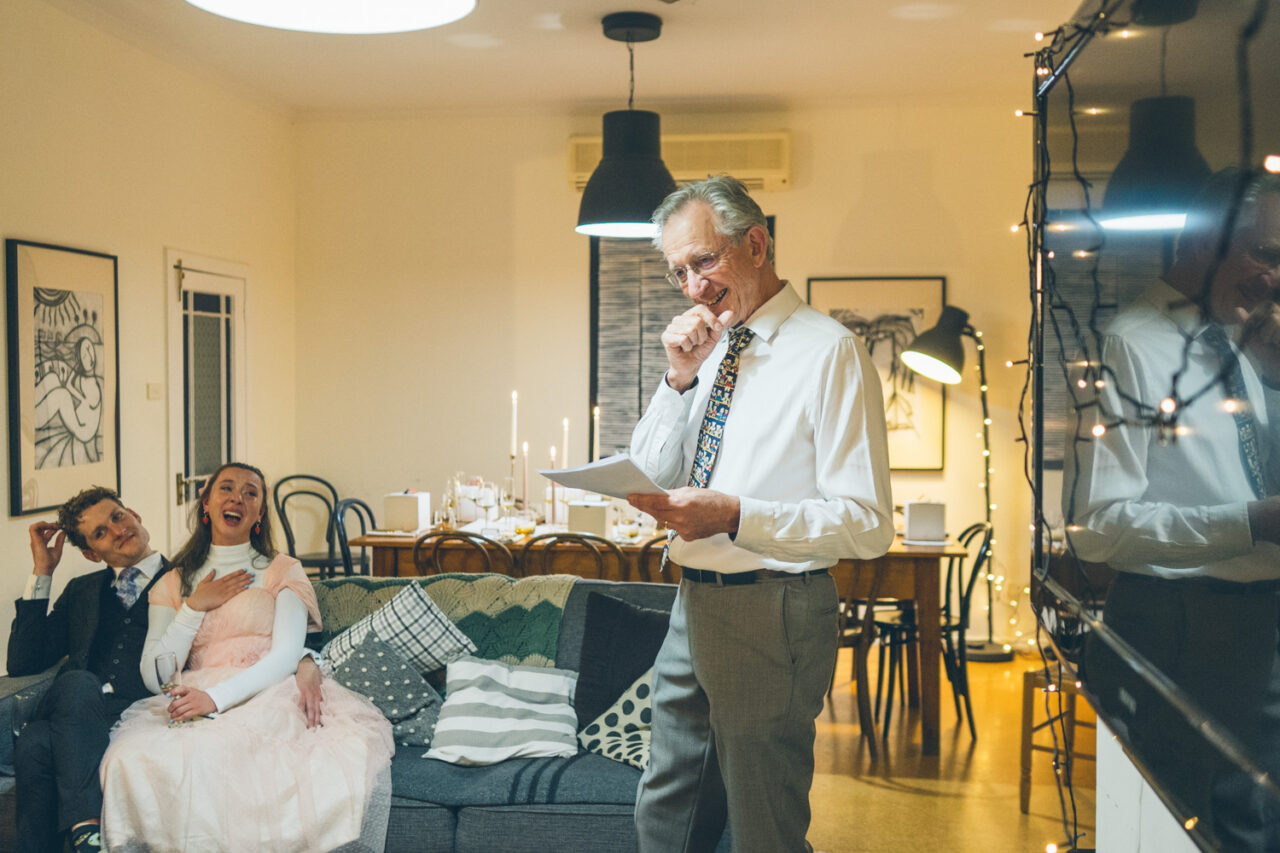 Father delivering a heartfelt speech during a winter wedding dinner in Daylesford.