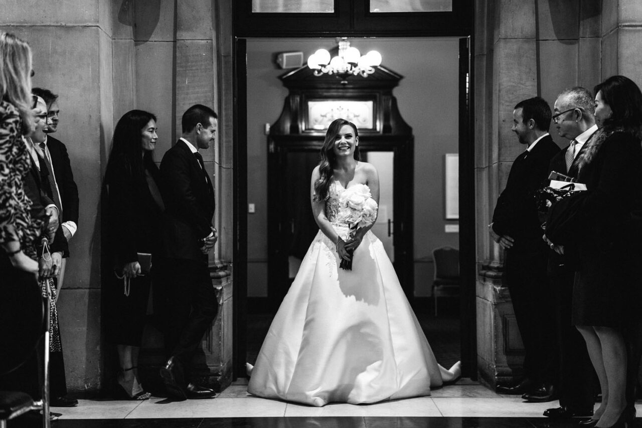 Bride standing in the doorway moments before entering her wedding ceremony at Melbourne Town Hall.