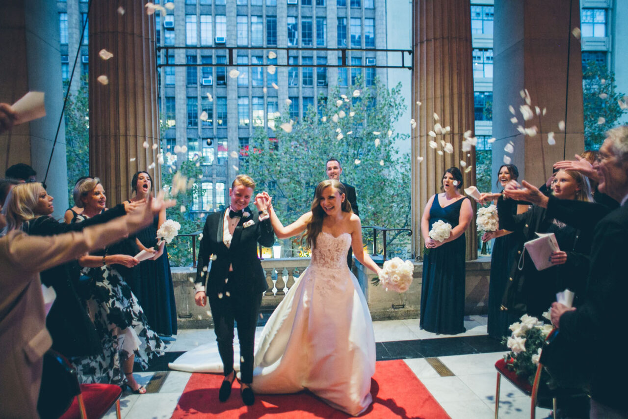 Couple celebrating with confetti after their wedding ceremony at Melbourne Town Hall.