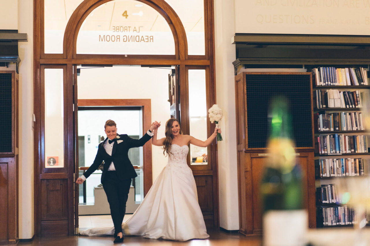 Couple entering their wedding reception at Melbourne Town Hall in Melbourne.