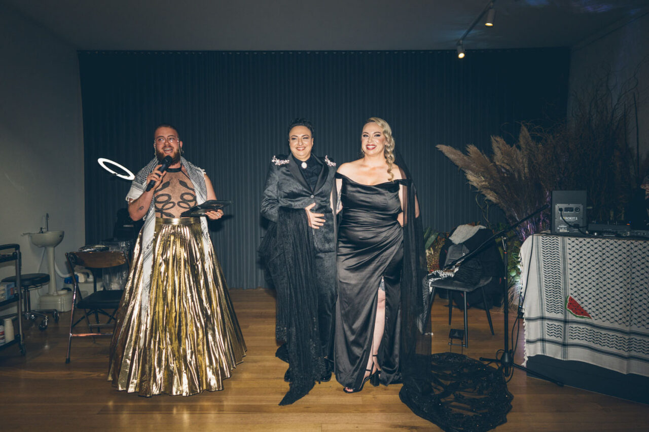 Nevo Zisin MC celebrating with newly married couple during wedding reception