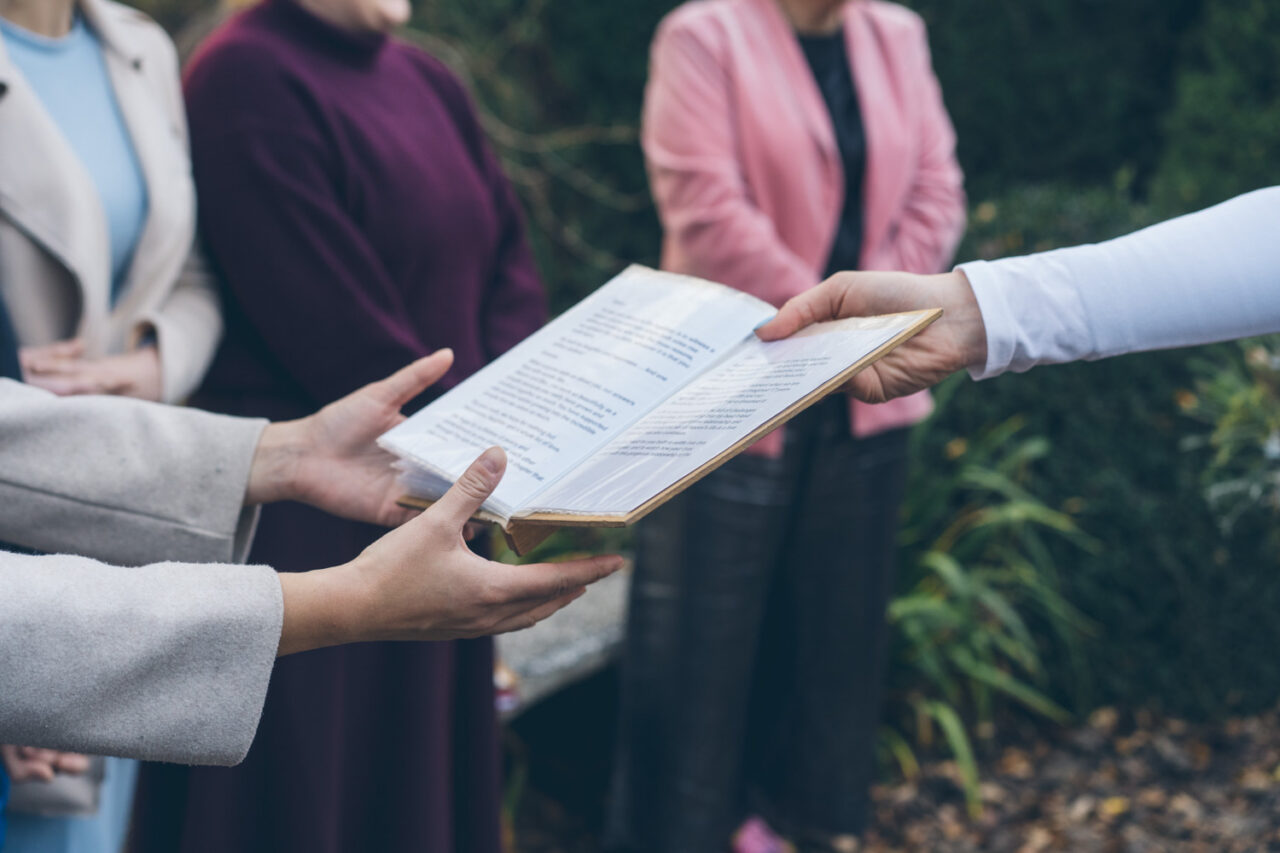 Close up of vows being read during an outdoor winter wedding ceremony in Daylesford.