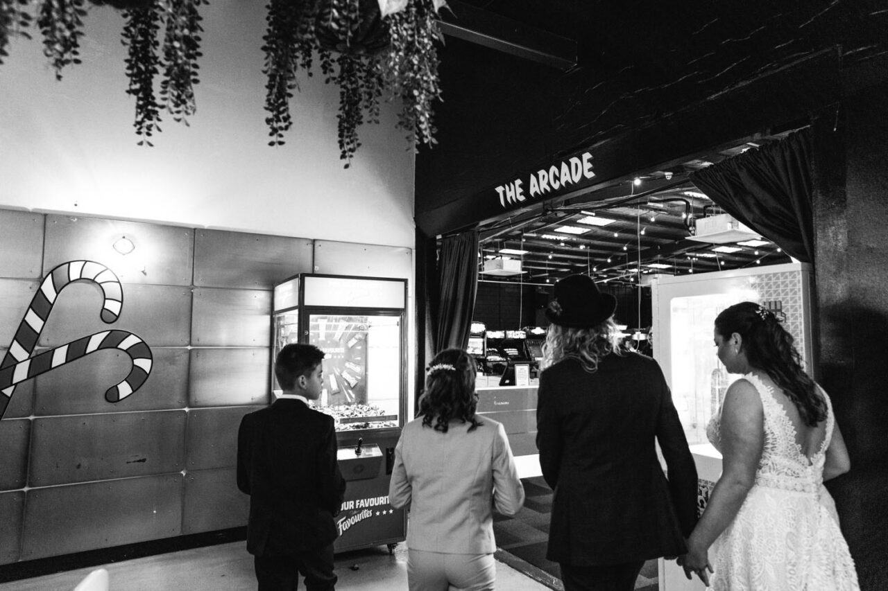 Wedding guests and couple walking toward the arcade area during a reception at Welcome to Thornbury Melbourne.