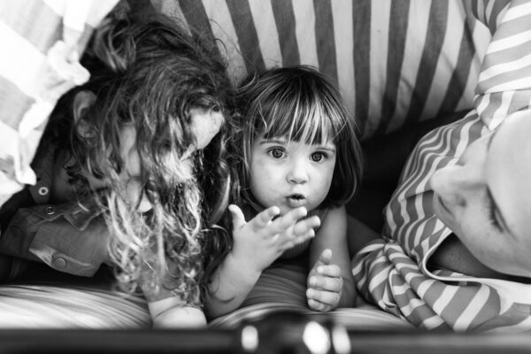 Two young siblings tucked in close together, captured in black and white during a Your Story documentary family session, Surf Coast Victoria 2025.