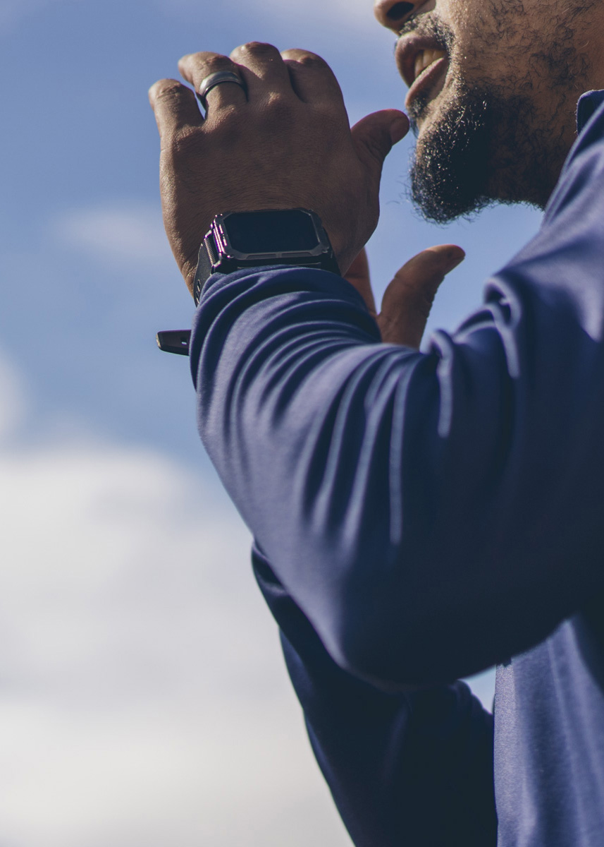Close up of a coach's hands and beard calling out instructions on the sideline